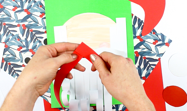 Arty Crafty Kids | Printable Paper Santa Craft - An engaging and fun Paper Santa Craft for kids. With his bouncy nose and curly beard, it's a Christmas craft that promotes scissor skills and fine motor development #christmas #christmascraft #printable #kidscraft #template