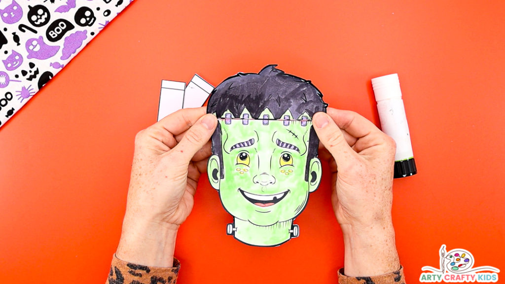 Image Step 3: Folding along the hair lines of the Frankenstein template.