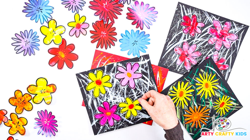 Image of a hand glueing the flowers onto the painted cardstock.