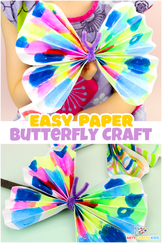 A colorful paper butterfly made from children's artwork, featuring accordion-style folded wings and a pipe cleaner body. This simple and fun craft is ideal for preschoolers, helping to recycle art and develop fine motor skills. Perfect for a vibrant school display.