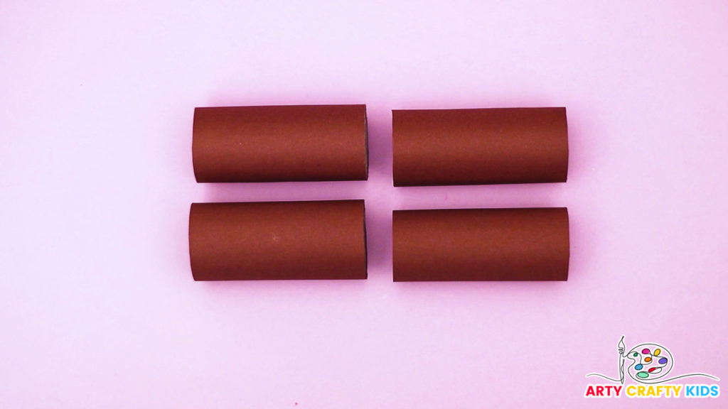 Image of four paper rolls wrapped in brown paper.