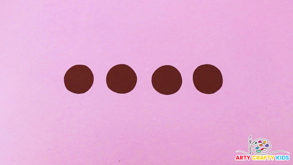 Image of four brown circles - the bases for the paper rolls.