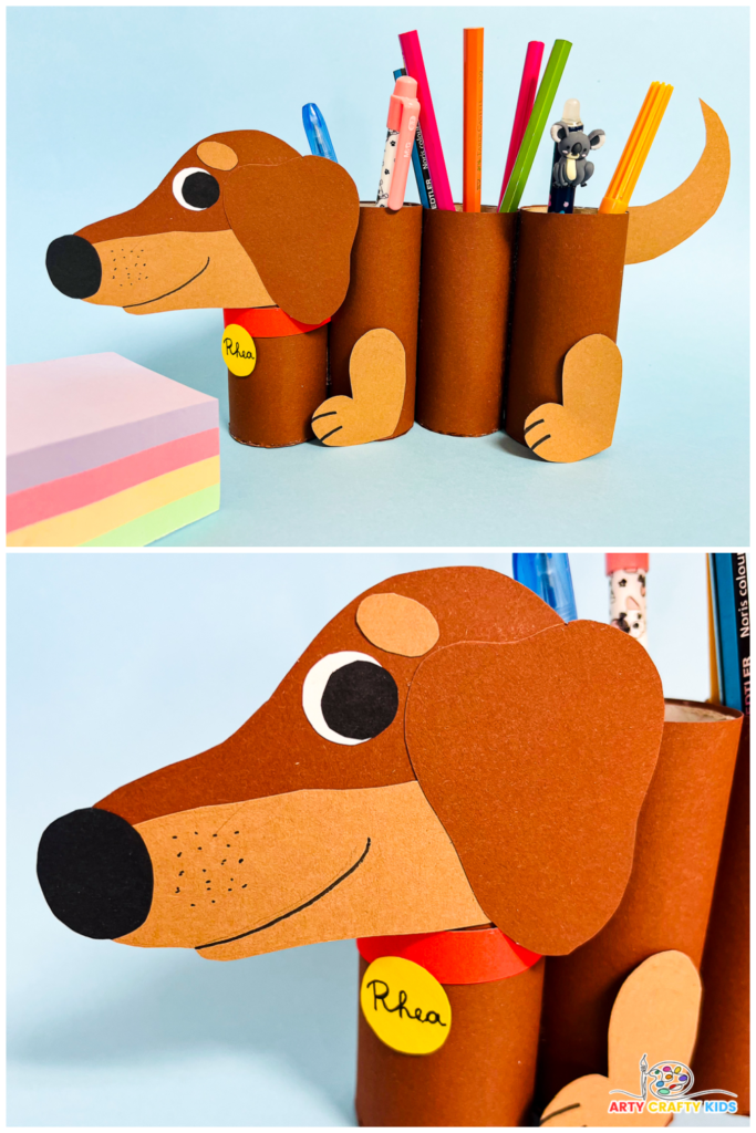 "An adorable DIY paper roll dog pencil holder made from recycled materials, perfect for organizing school supplies. The craft features a two-toned dachshund design with a cute collar and name tag. Suitable for kids of all ages with a printable template available