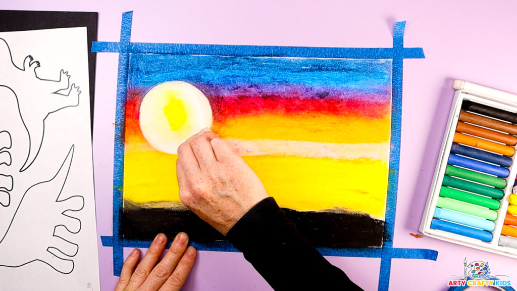 Image of a hand blending the sun into the sunset background.