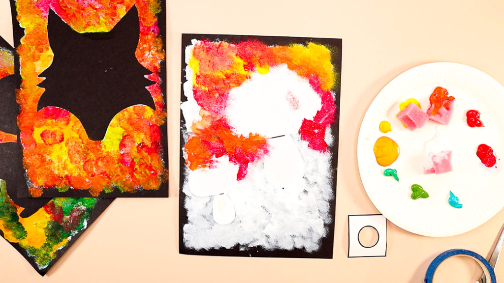 Image of the upper half of the Autumn Silhouette painting filled with red, orange, and yellow shades of paint.