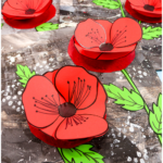 3D Remembrance Day poppy craft with red tissue paper poppies on a layered monochrome background.