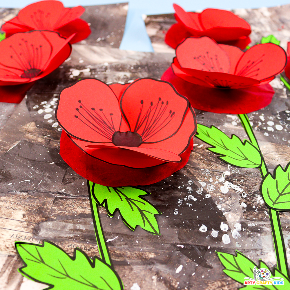 3D Remembrance Day poppy craft with red tissue paper poppies on a layered monochrome background.