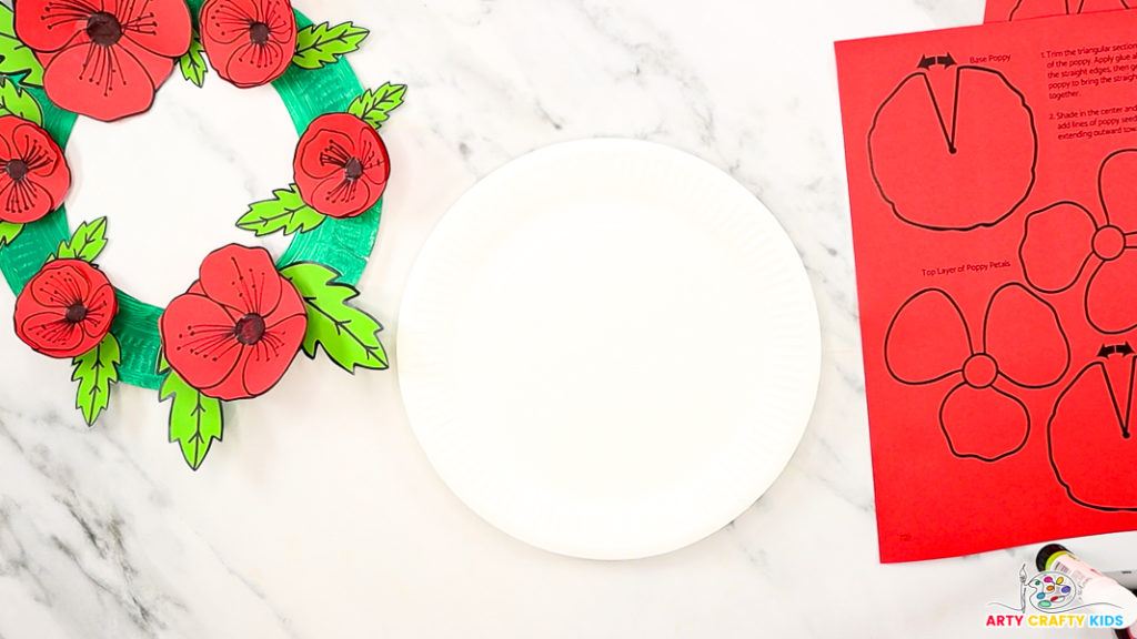 Image featuring a blank paper plate, poppy wreath templates and a completed paper plate poppy wreath.