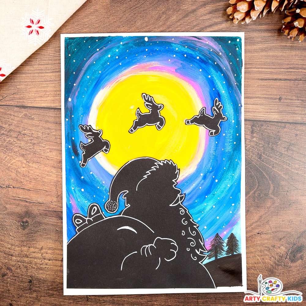 A festive Santa silhouette art project featuring a glowing yellow moon, a vibrant blue and purple night sky, and reindeer silhouettes flying across the moon. The artwork includes fine details and is surrounded by rustic pinecones for a cozy holiday feel. Perfect for Christmas crafts with kids.