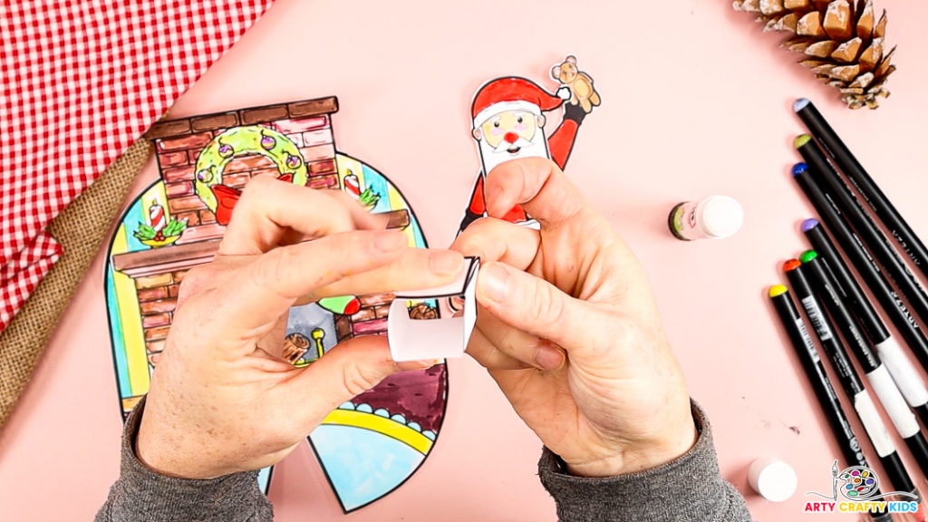 Image features a hand creating a supporting paper cube.