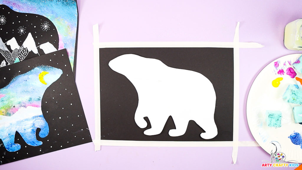 Image featuring a polar bear template on top of black card stock.