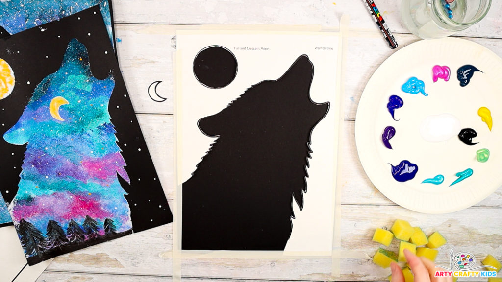 Image featuring a negative space silhouette of a wolf affixed to black card stock.