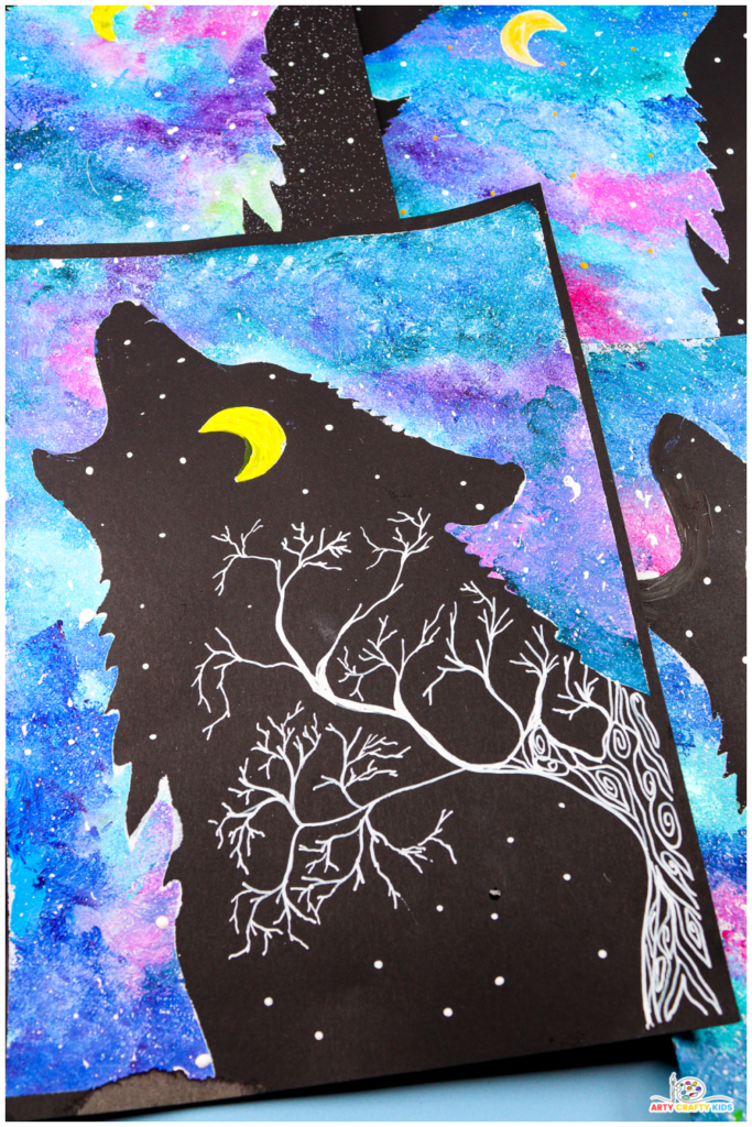 A close-up of colorful Wolf Silhouette Paintings featuring vibrant northern lights-inspired skies in shades of blue, pink, and purple. The silhouettes include glowing yellow moons, white stars, and pine tree details, creating a magical and imaginative art project.