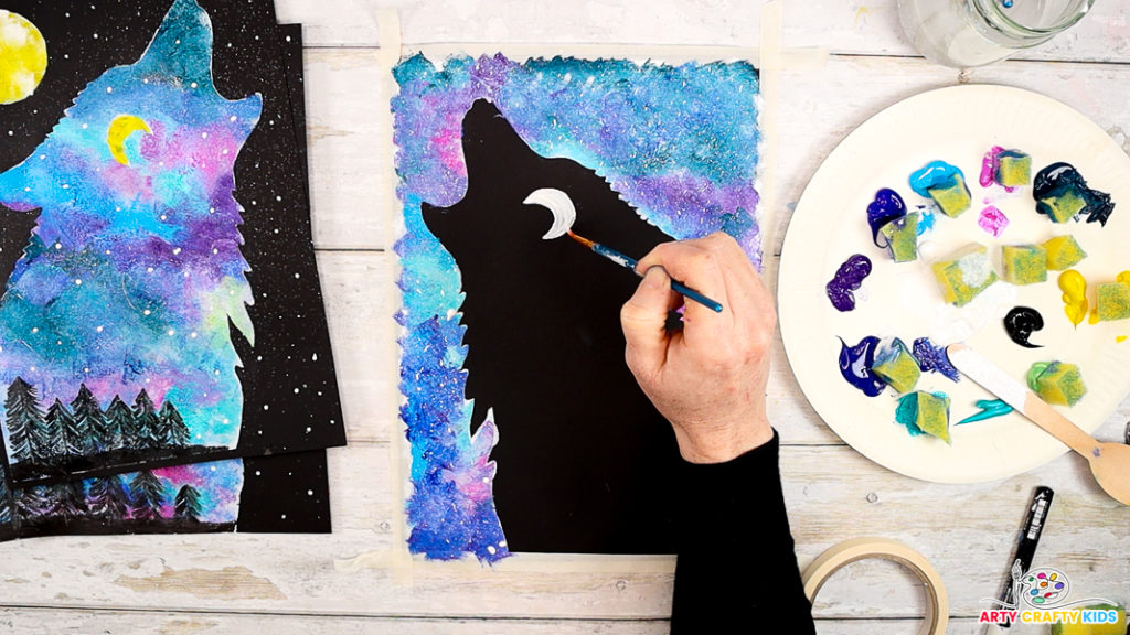 Image showcasing the wolf silhouette. A hand is drawing a crescent moon in the place of an eye.