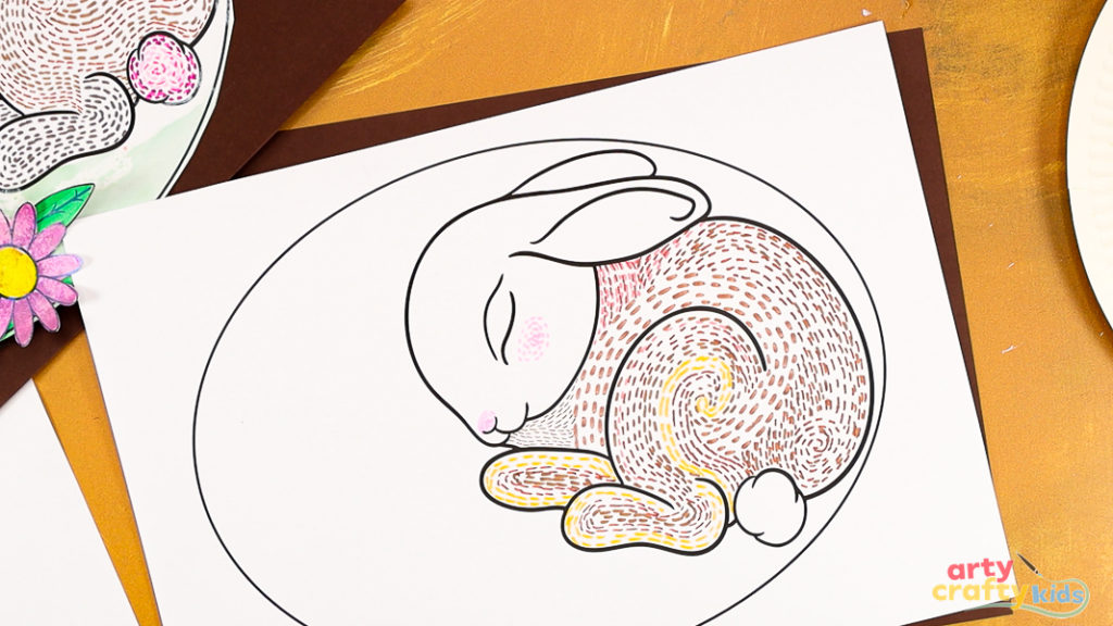 Image featuring a sleeping bunny complete with dashed lines within its legs and back. They vary in size and direction.